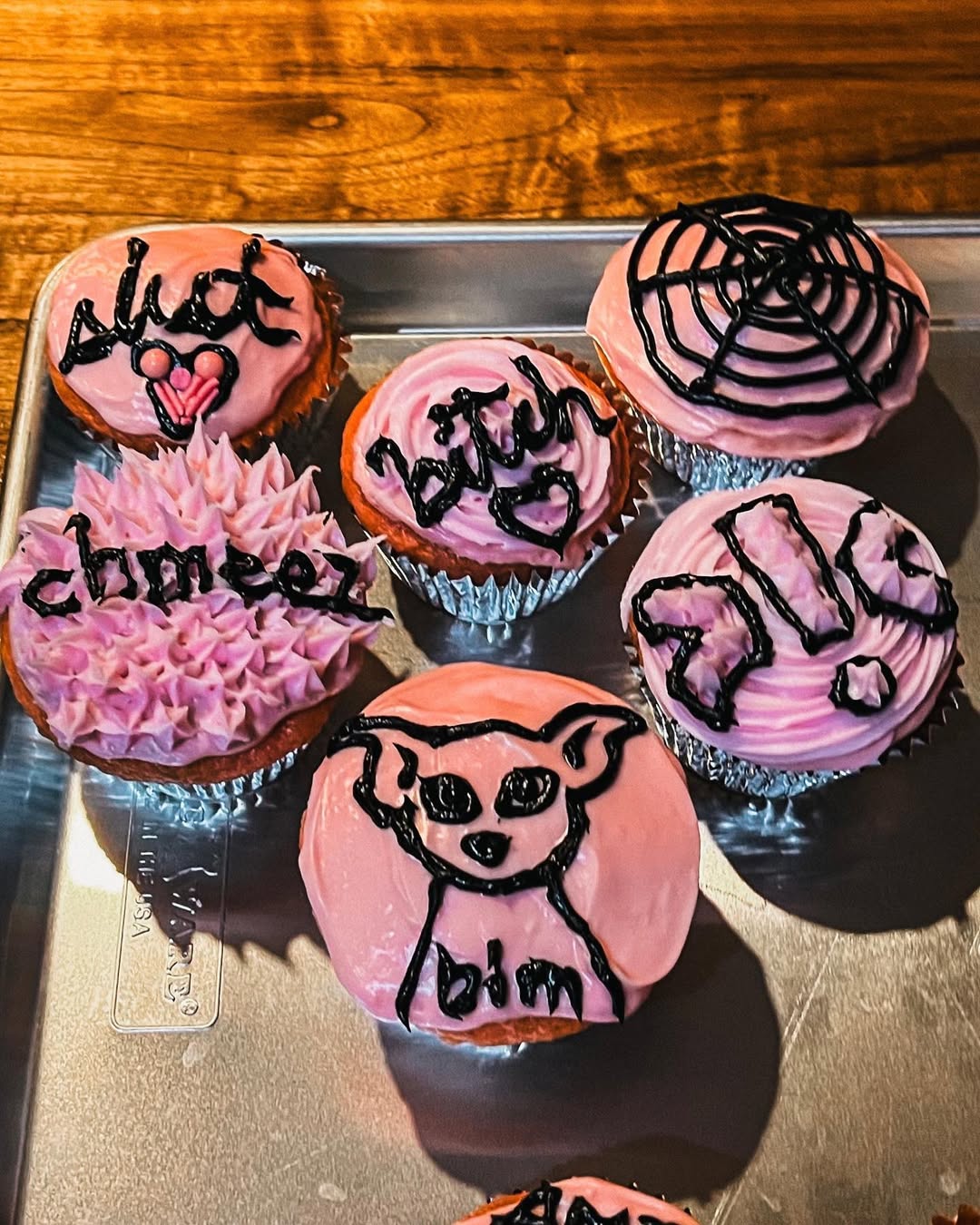 photo of cupcakes with pink frosting and words on top