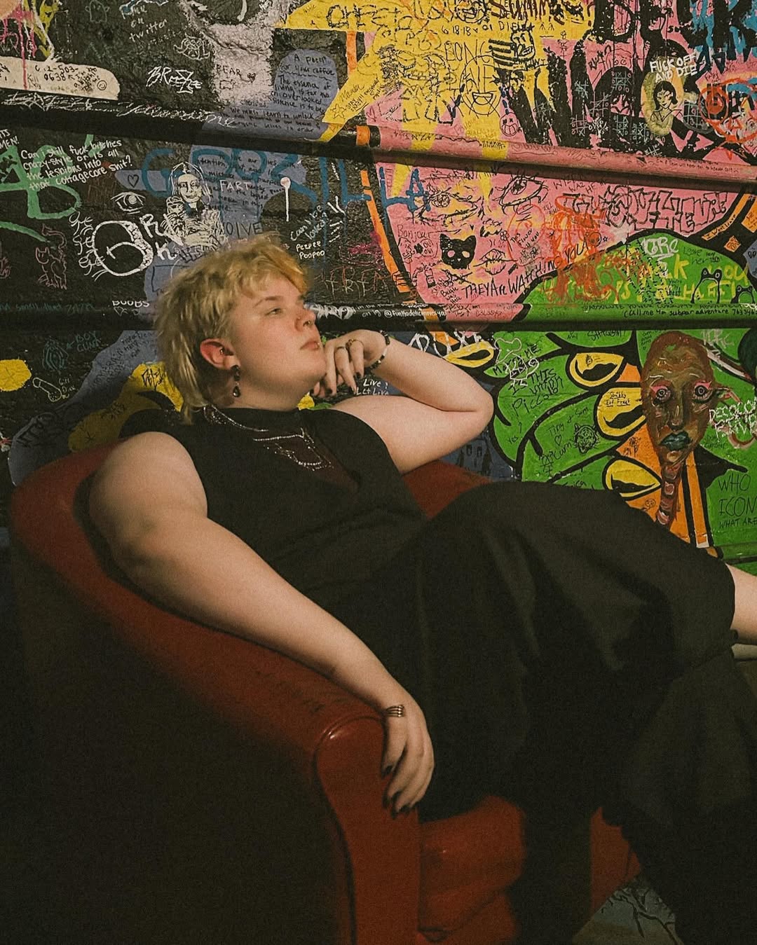 photo of amara sitting in a red chair