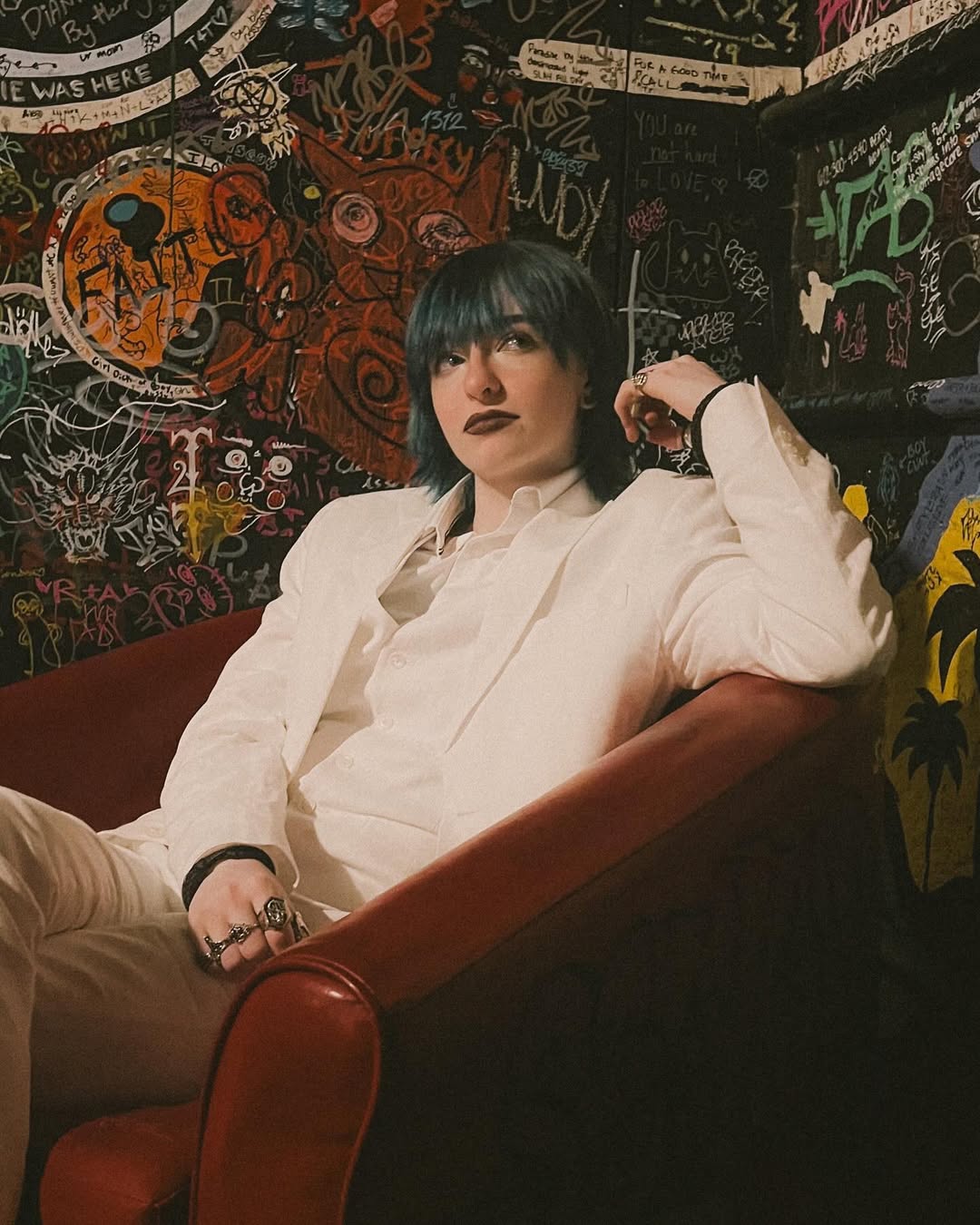 photo of cal sitting in a red chair